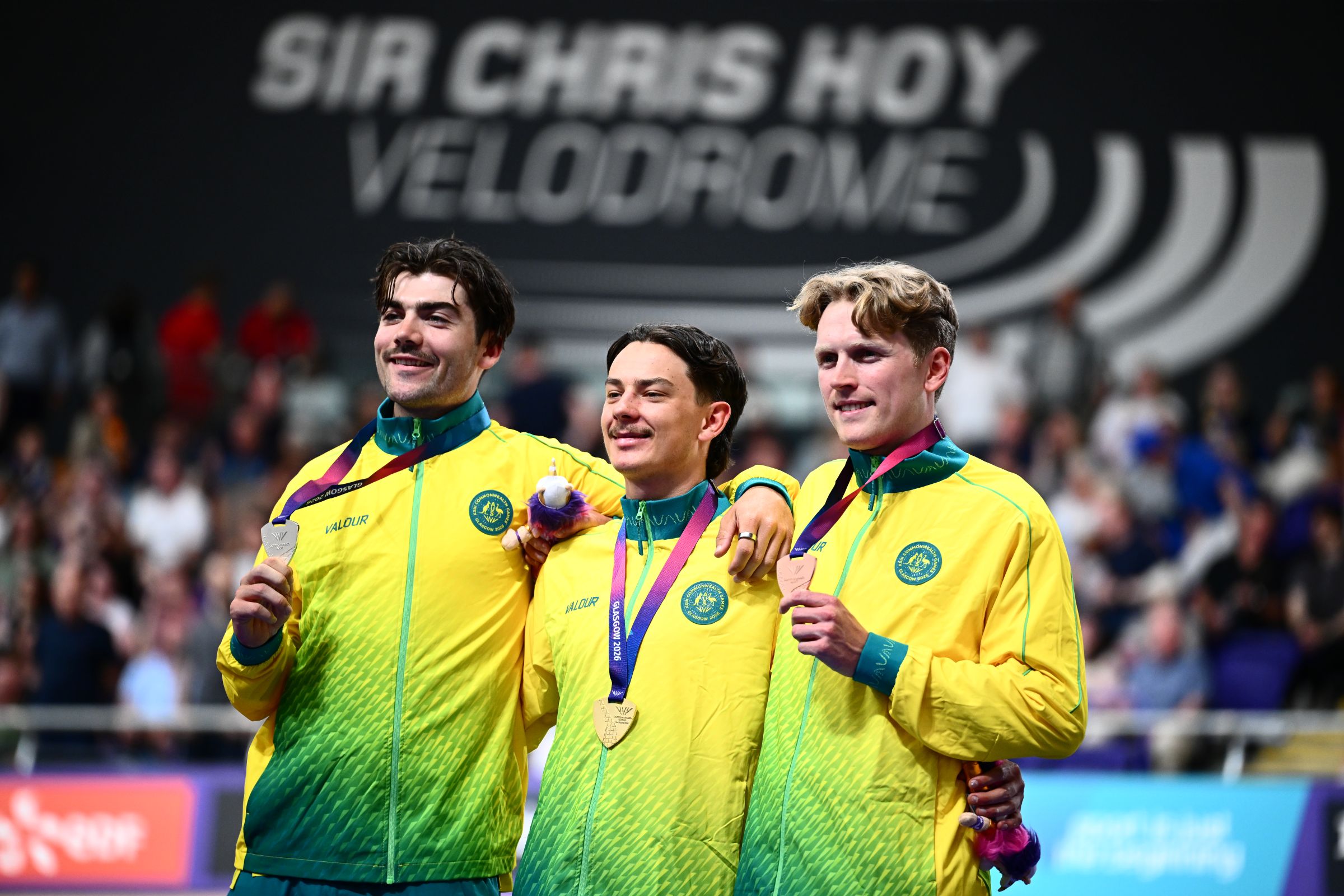 Oliver Bleddyn, Conor Leahy and James Moriarty of Australia share the podium of the men's individual pursuit at the Glasgow 2026 Commonwealth Games.